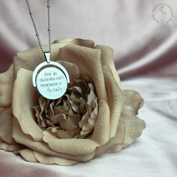 She is clothed with strength and dignity - Spinning Necklace